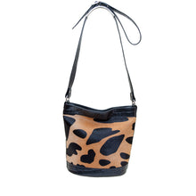 Load image into Gallery viewer, Izzy Cowhide Bucket Bag - Animal Print
